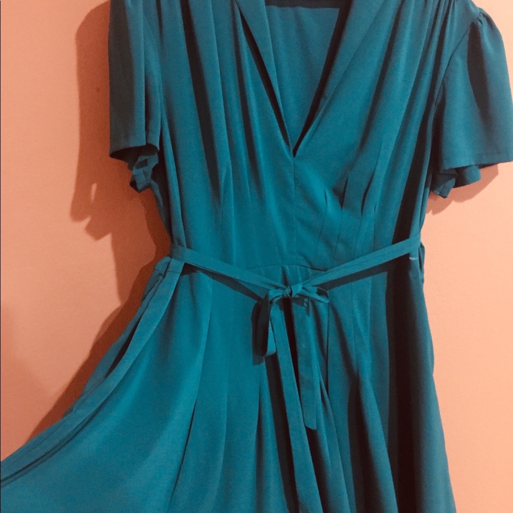 Beautiful peacock green dress.